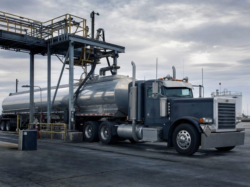 Stainless fuel tanker at a bulk fuel terminal loading rack